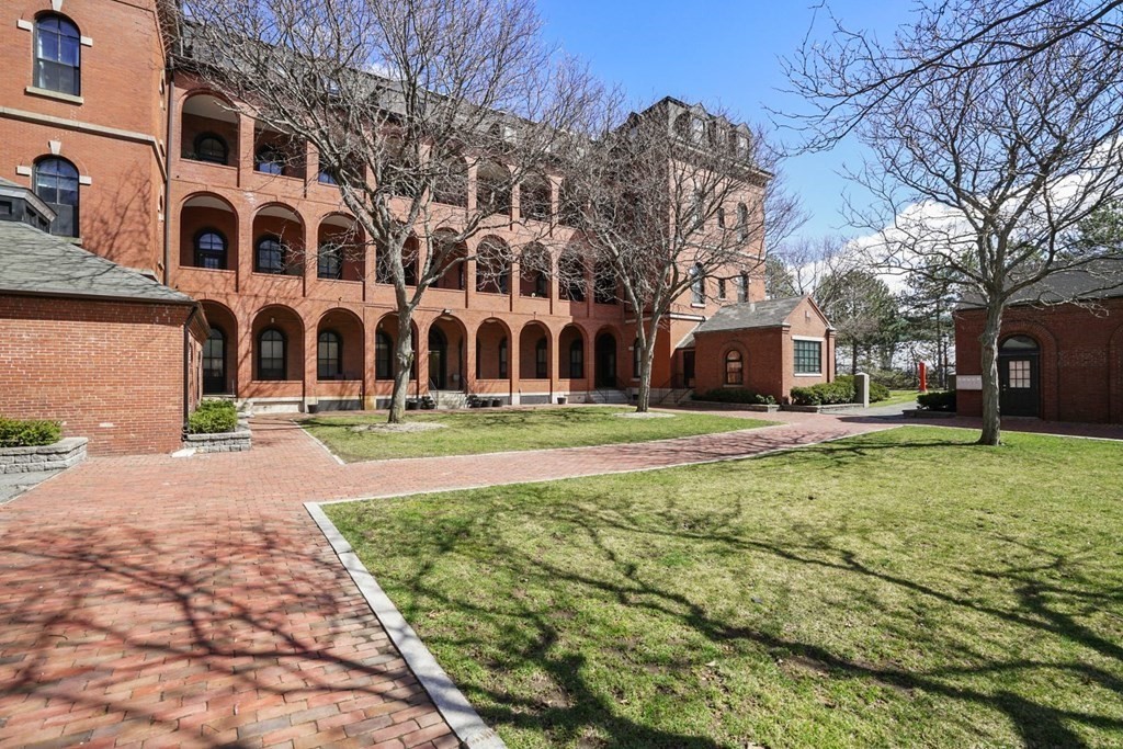 100 Captains Row, Unit 301 Chelsea, MA 02150 - Photo 2 of 23 a front view of building with yard