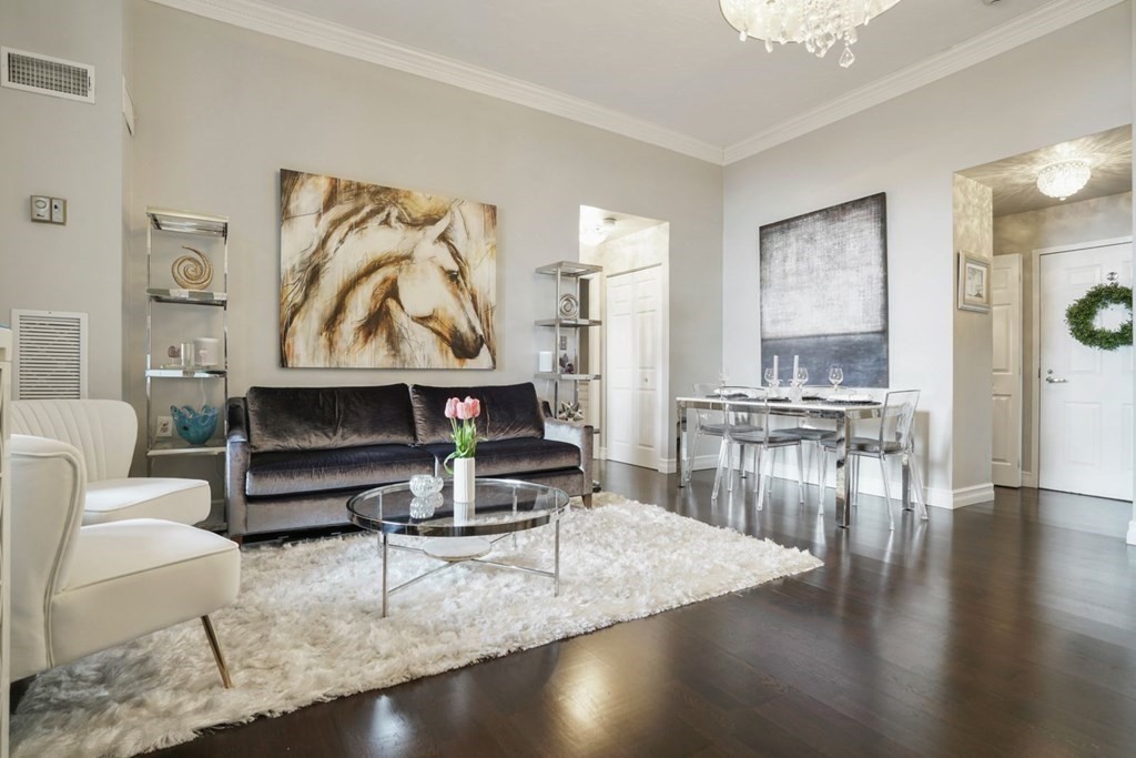100 Captains Row, Unit 301 Chelsea, MA 02150 - Photo 22 of 23 a living room with furniture a rug and a table