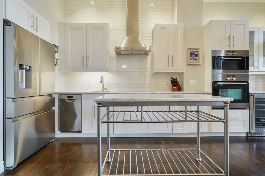 100 Captains Row, Unit 301 Chelsea, MA 02150 - Photo 6 of 23 a kitchen with stainless steel appliances granite countertop a refrigerator a stove and a sink