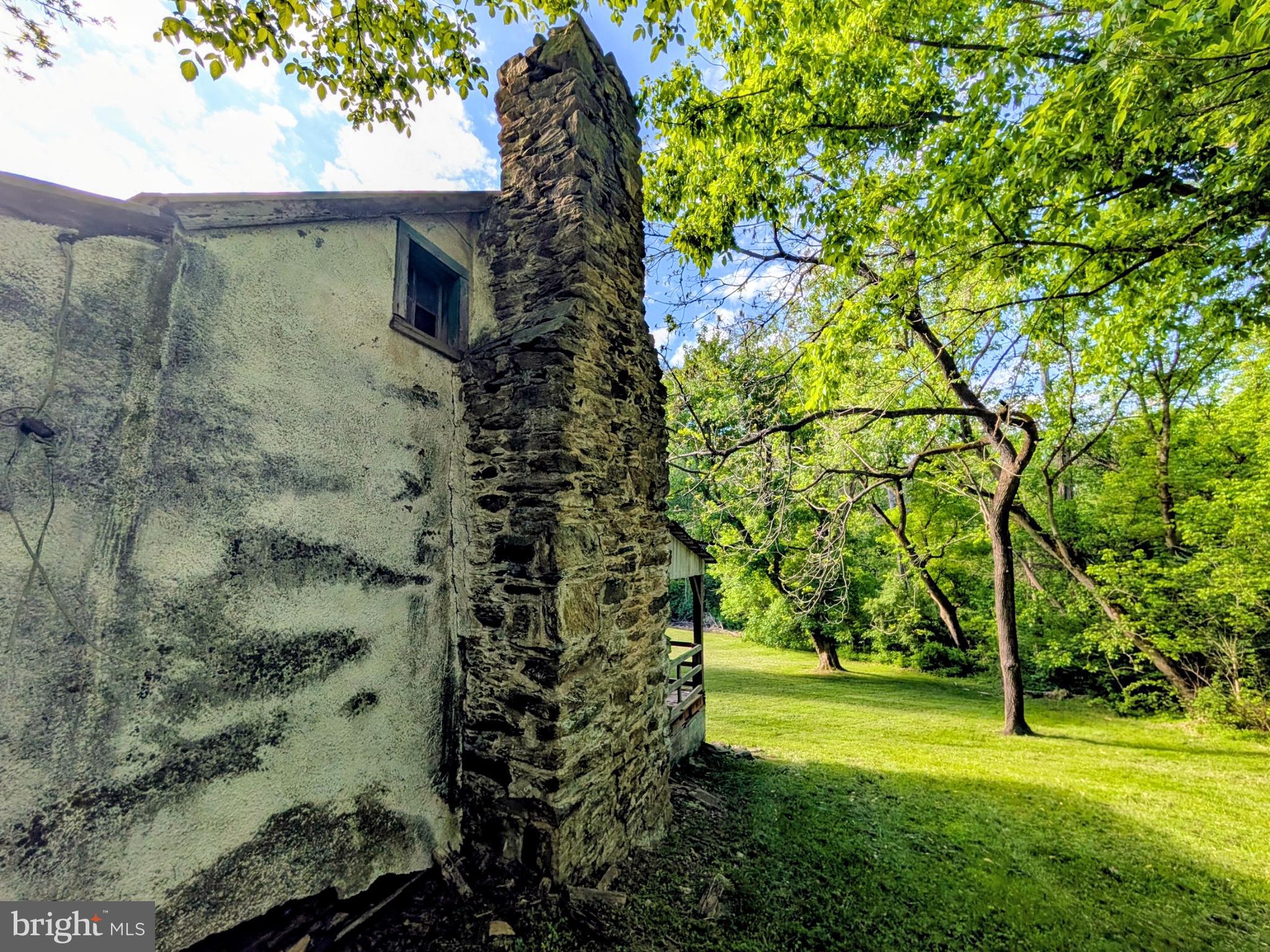 189 Piedmont Orchard Road Linden, VA 22642 - Photo 16 of 19 West side of home showing rock chimney