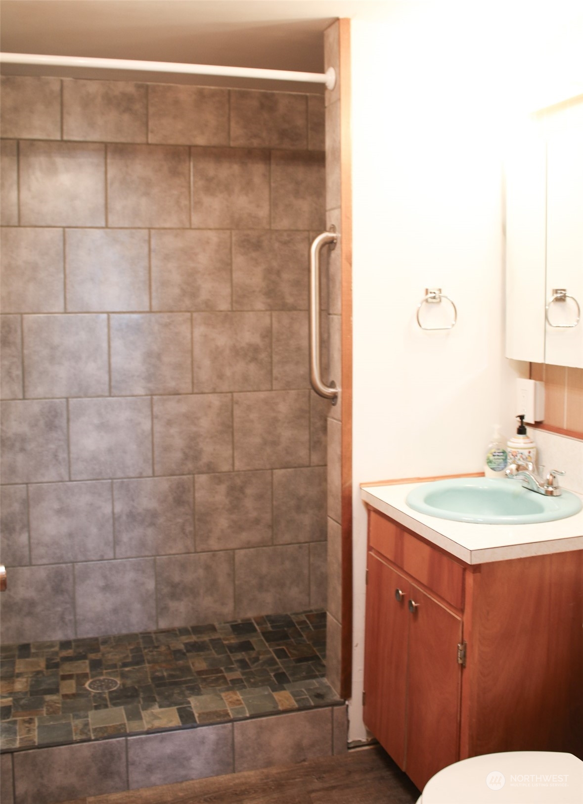 1053 Shorey Road Chehalis, WA 98532 - Photo 28 of 39 a bathroom with a sink a mirror and shower