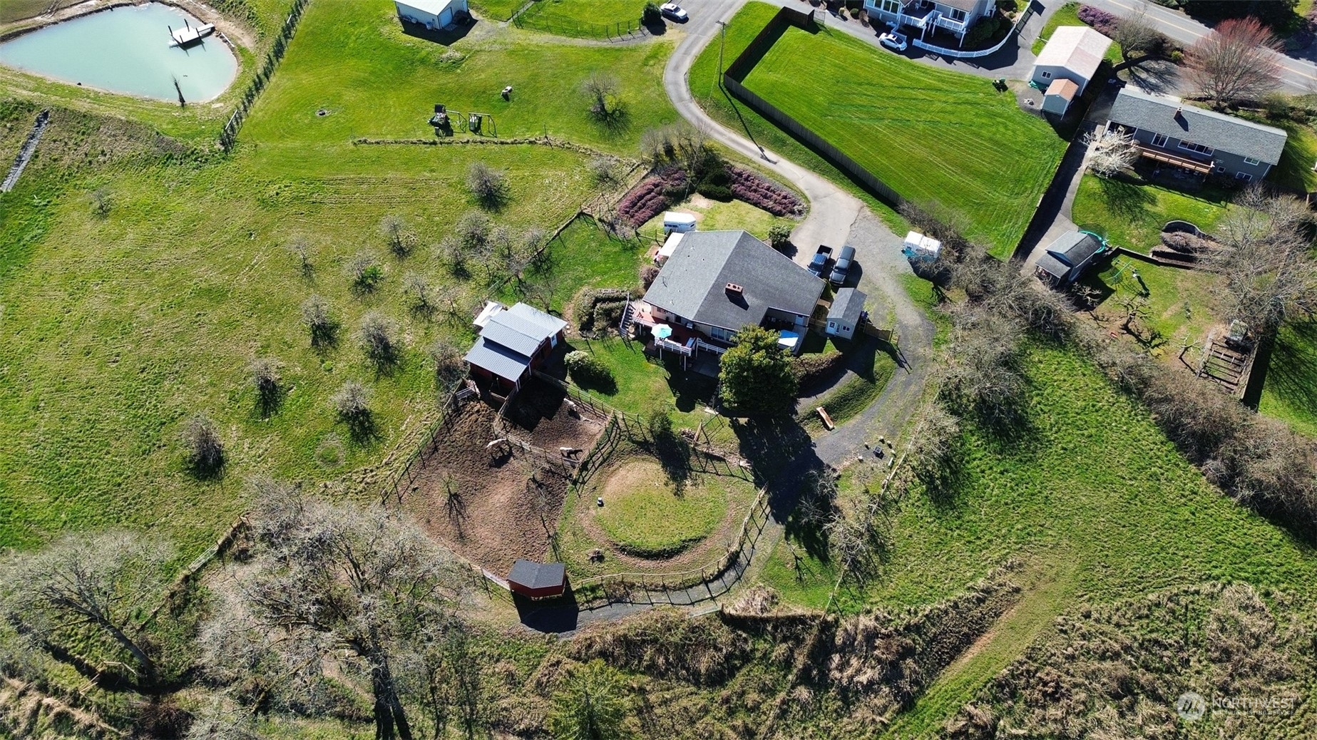 1053 Shorey Road Chehalis, WA 98532 - Photo 35 of 39 an aerial view of a house with a yard and large trees