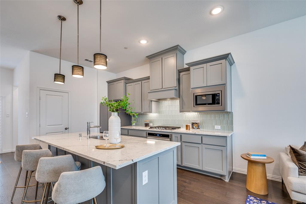 3718 Pelican Rst Way Arlington, TX 76005 - Photo 2 of 37 a kitchen with a sink cabinets and wooden floor