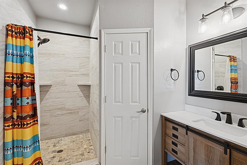 Tbd Tbd Cr-1990 Chico, TX 76431 - Photo 24 of 26 a bathroom with a sink and a mirror