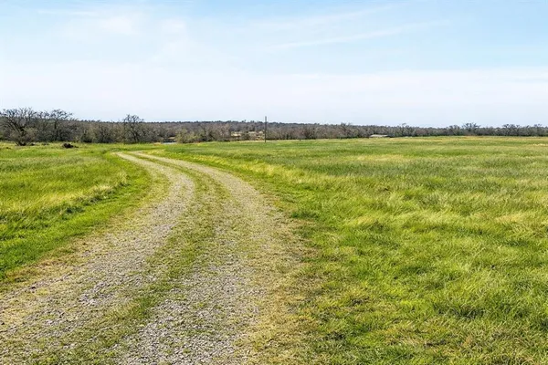 a view of a swimming pool and an outdoor seating