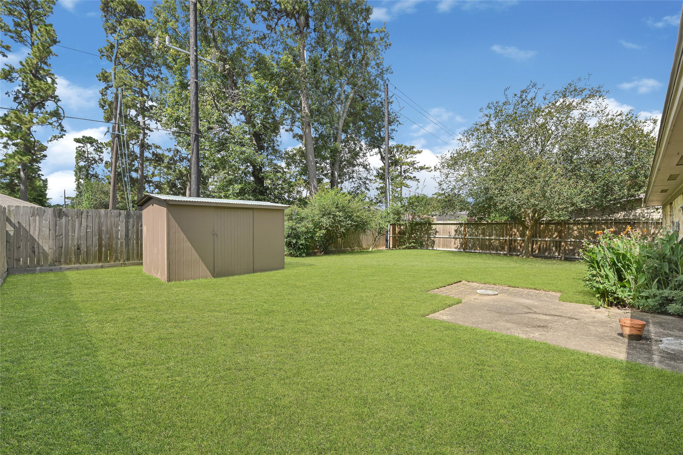 2426 Deasa Drive Spring, TX 77373 - Photo 25 of 27 Expansive back yard with great storage in the 8x12 shed