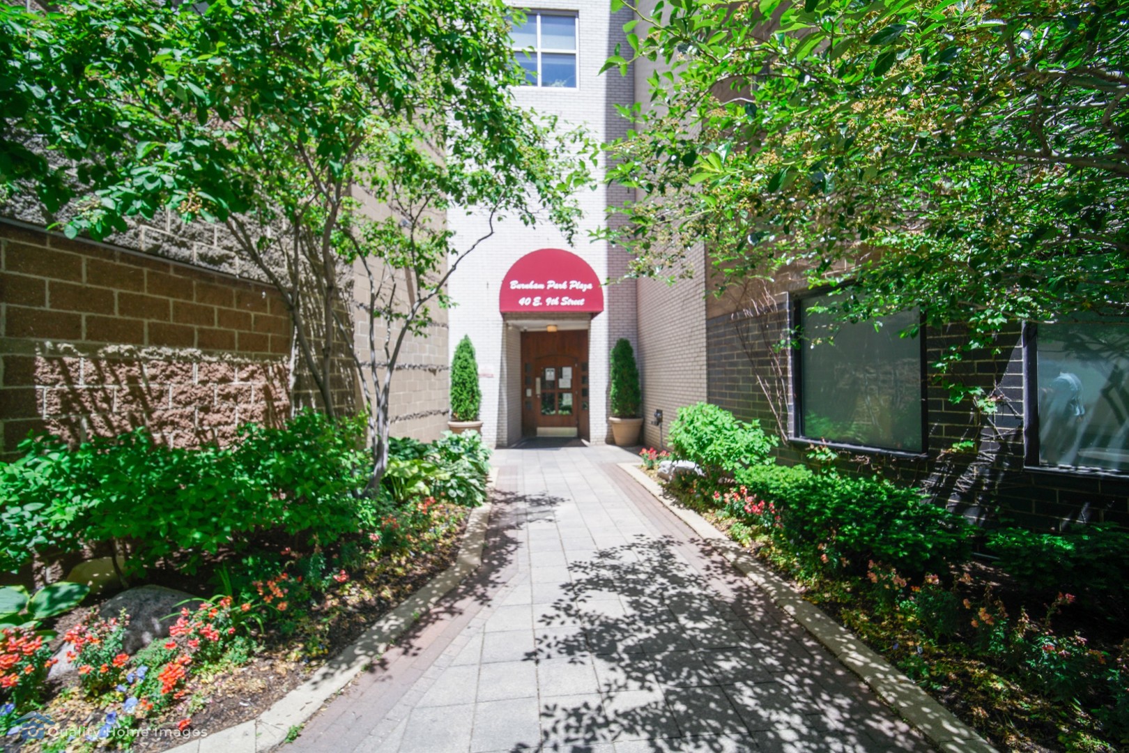 40 East 9th Street, Unit 405 Chicago, IL 60605 - Photo 1 of 18 a front view of a house with garden