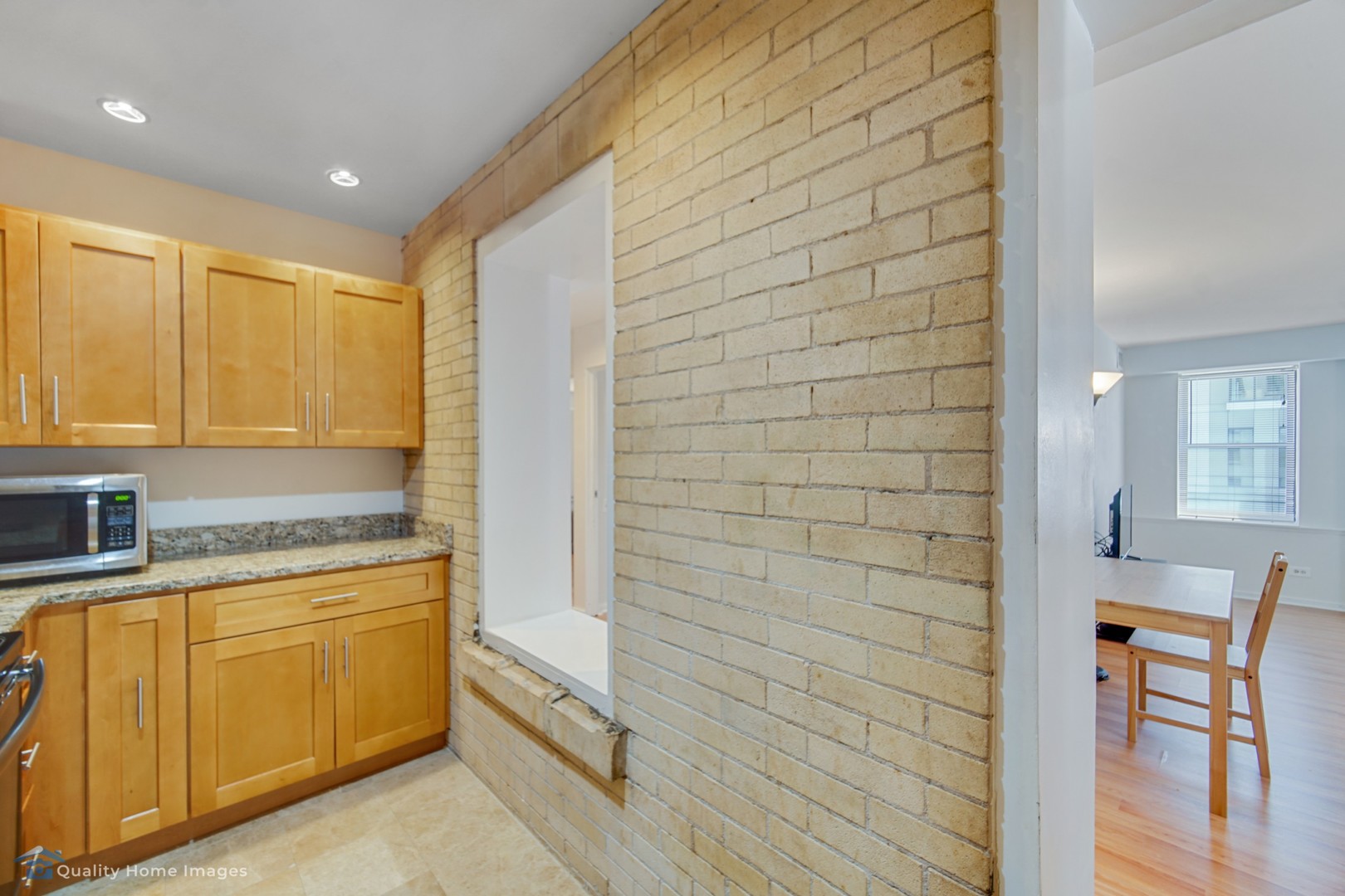 40 East 9th Street, Unit 405 Chicago, IL 60605 - Photo 11 of 18 a bathroom with a granite countertop sink and a mirror
