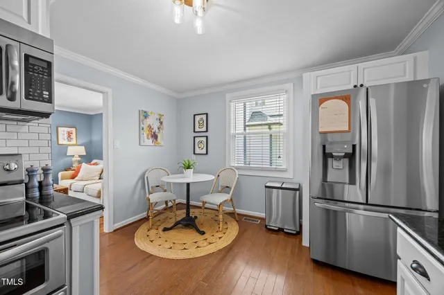 a kitchen with granite countertop a stove and a sink