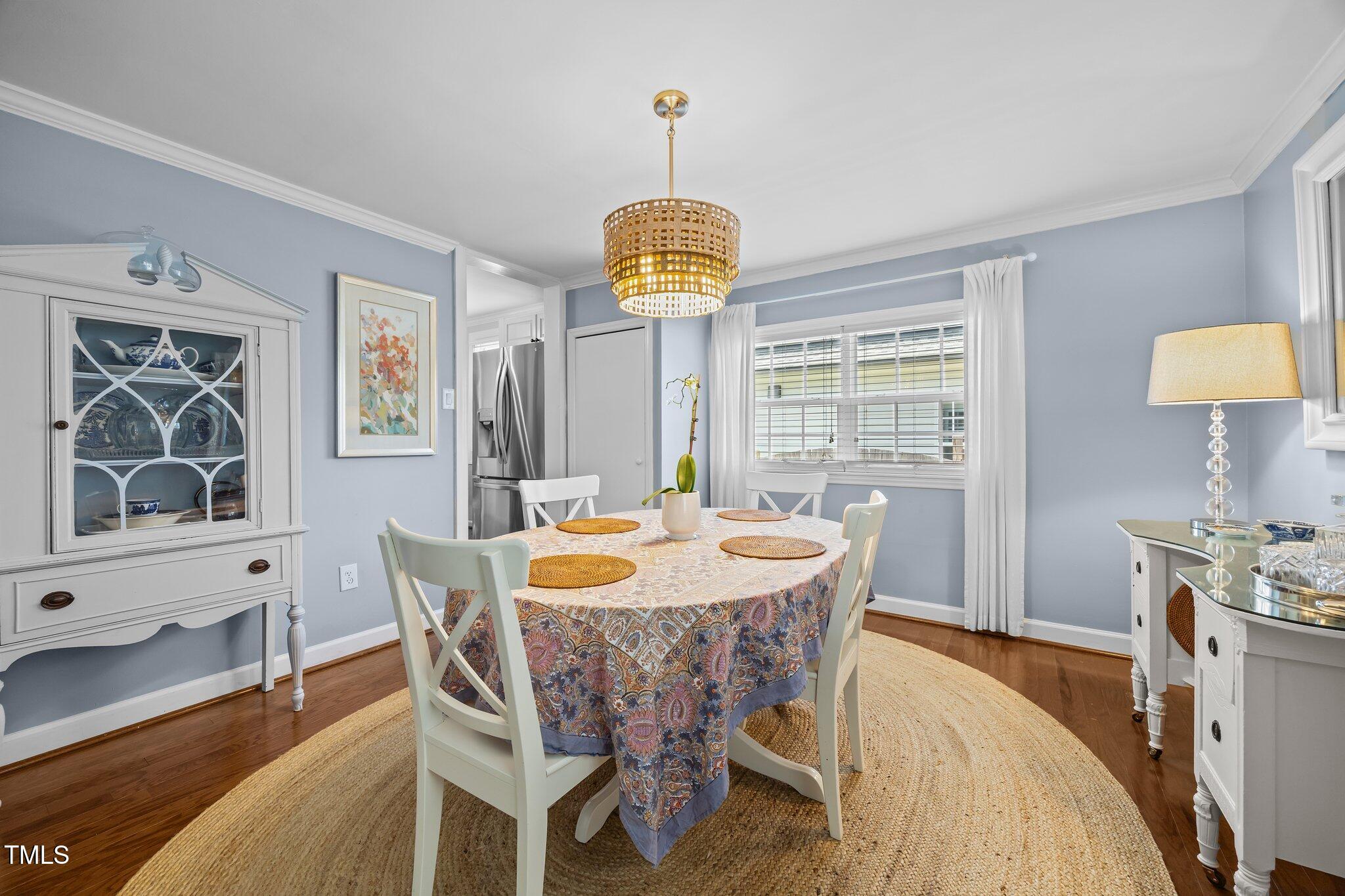 711 New Road Raleigh, NC 27608 - Photo 20 of 54 a dining room with furniture and window
