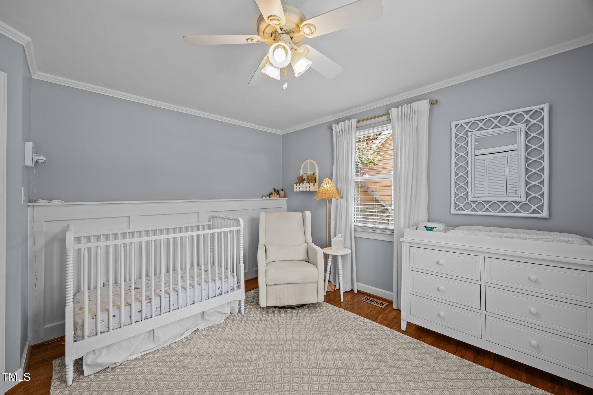 711 New Road Raleigh, NC 27608 - Photo 22 of 54 a bedroom with furniture and a window