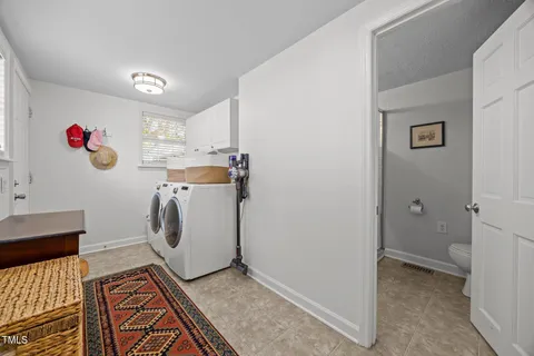 a bathroom with a sink mirror and a shower