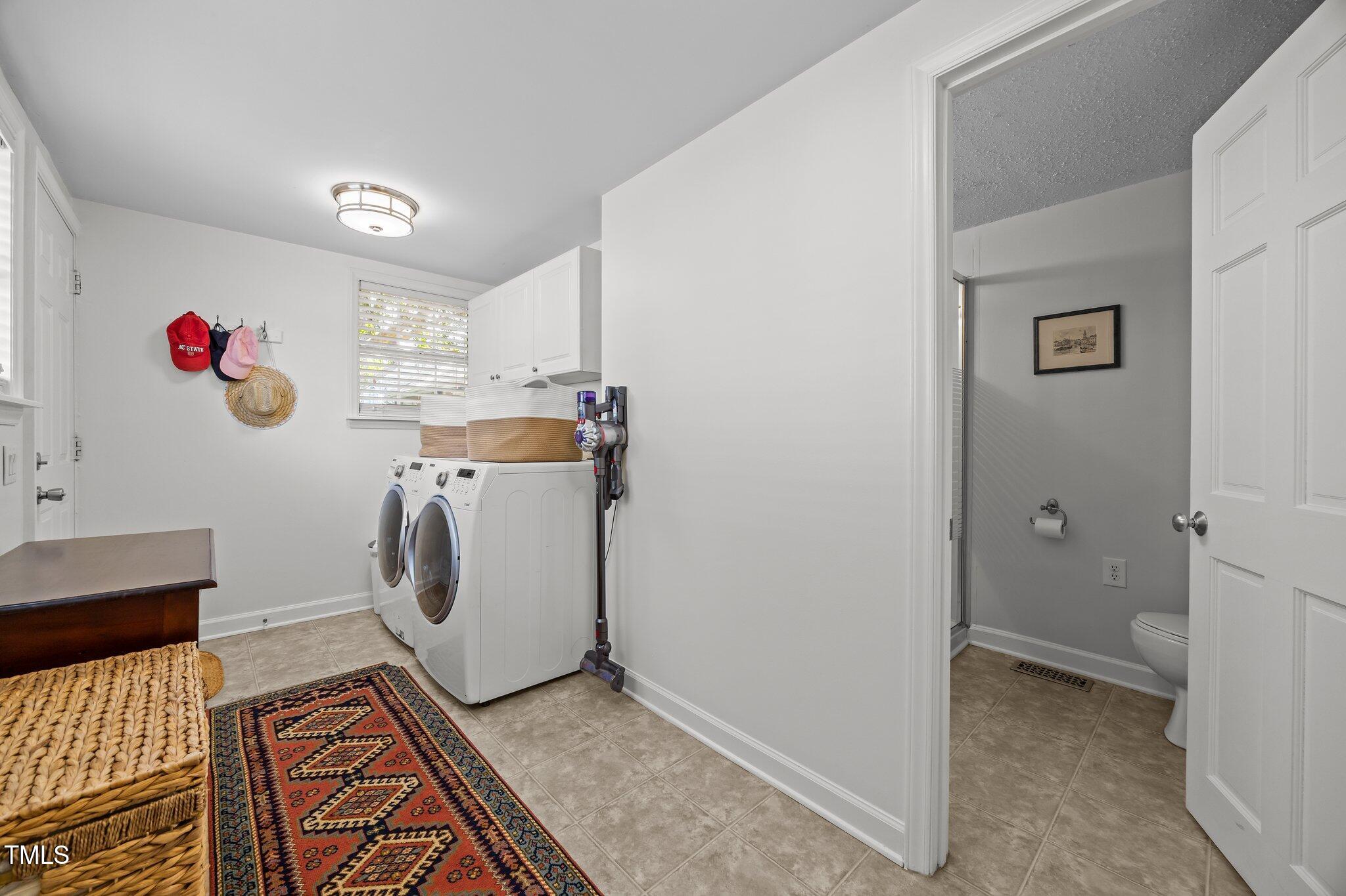 711 New Road Raleigh, NC 27608 - Photo 32 of 54 a utility room with dryer and washer