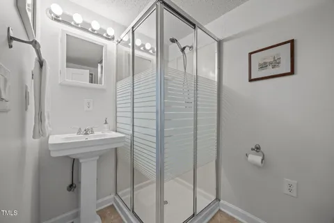 a backyard of a house with flower plants