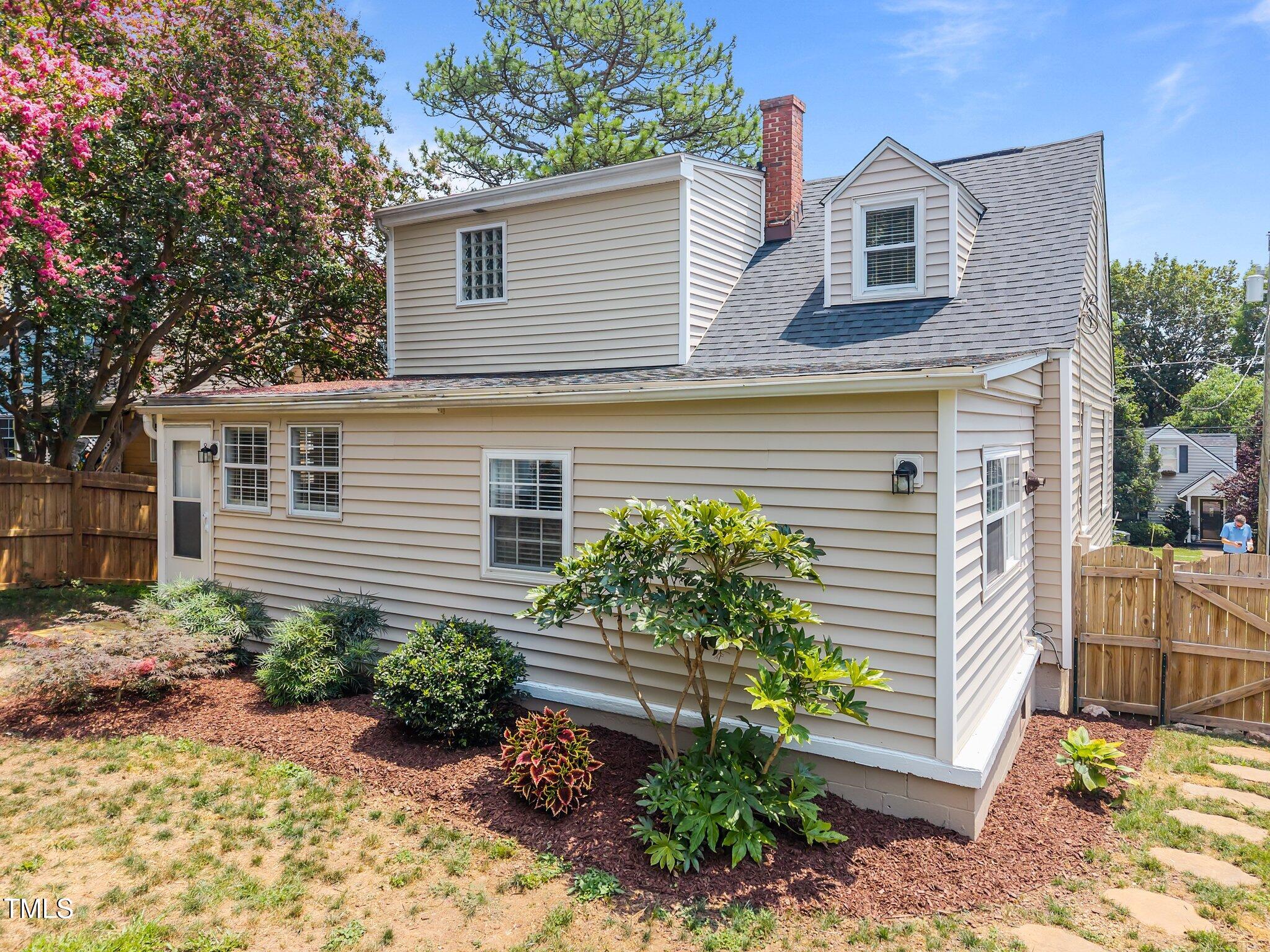 711 New Road Raleigh, NC 27608 - Photo 40 of 54 a front view of a house with garden