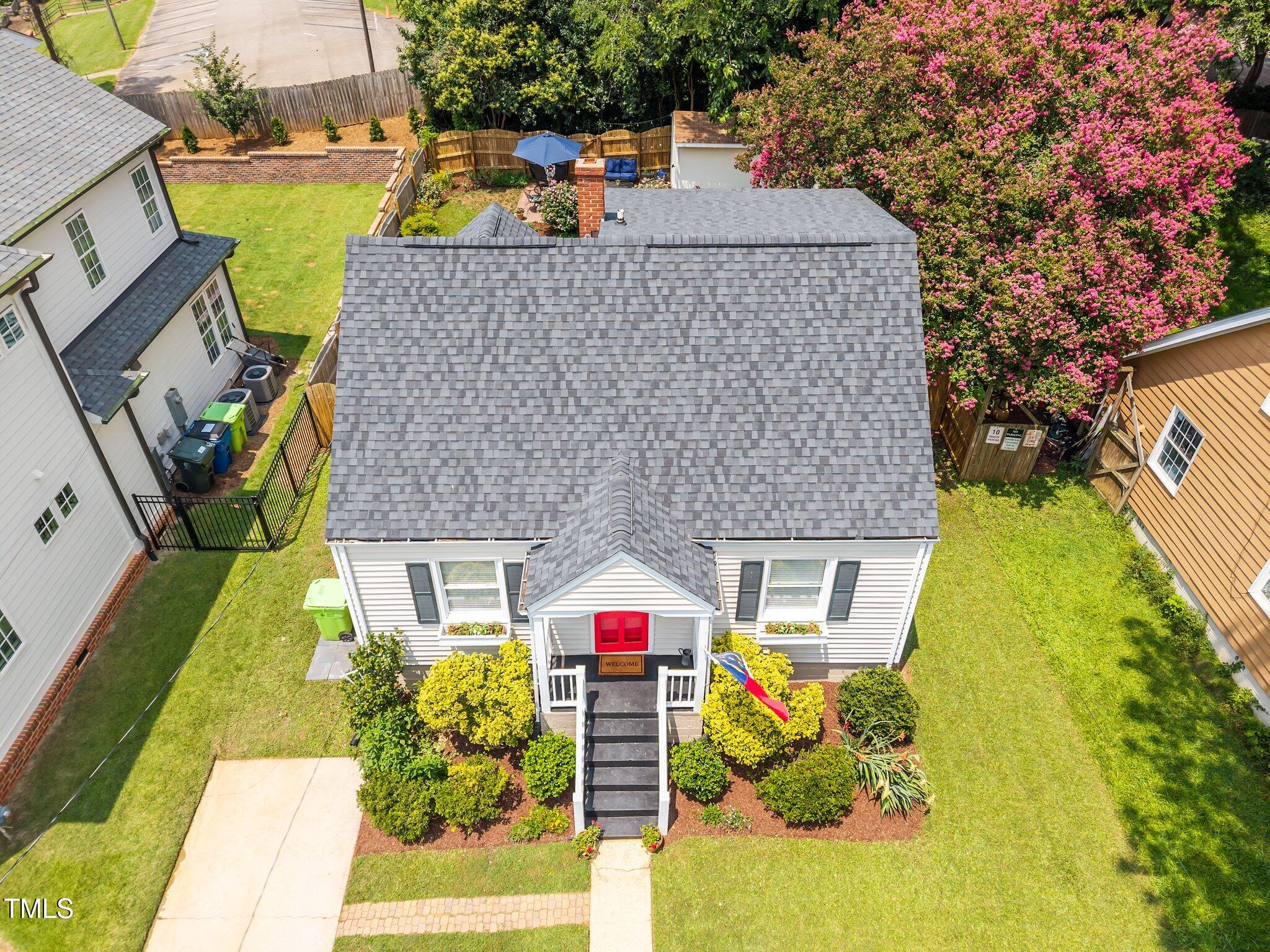 711 New Road Raleigh, NC 27608 - Photo 43 of 54 an aerial view of a house with swimming pool and large trees