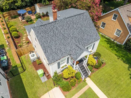 an aerial view of a house with a garden