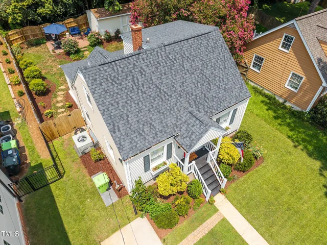 an aerial view of a house with a garden