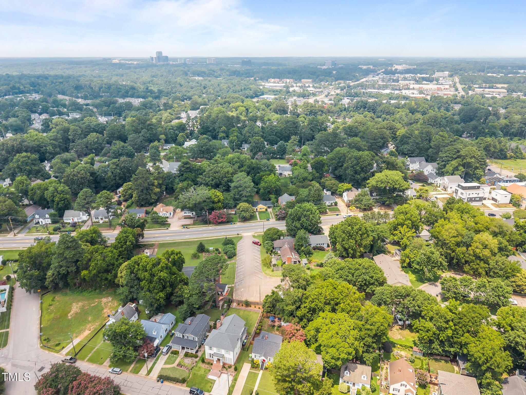 711 New Road Raleigh, NC 27608 - Photo 47 of 54 an aerial view of lake residential house with outdoor space and trees around