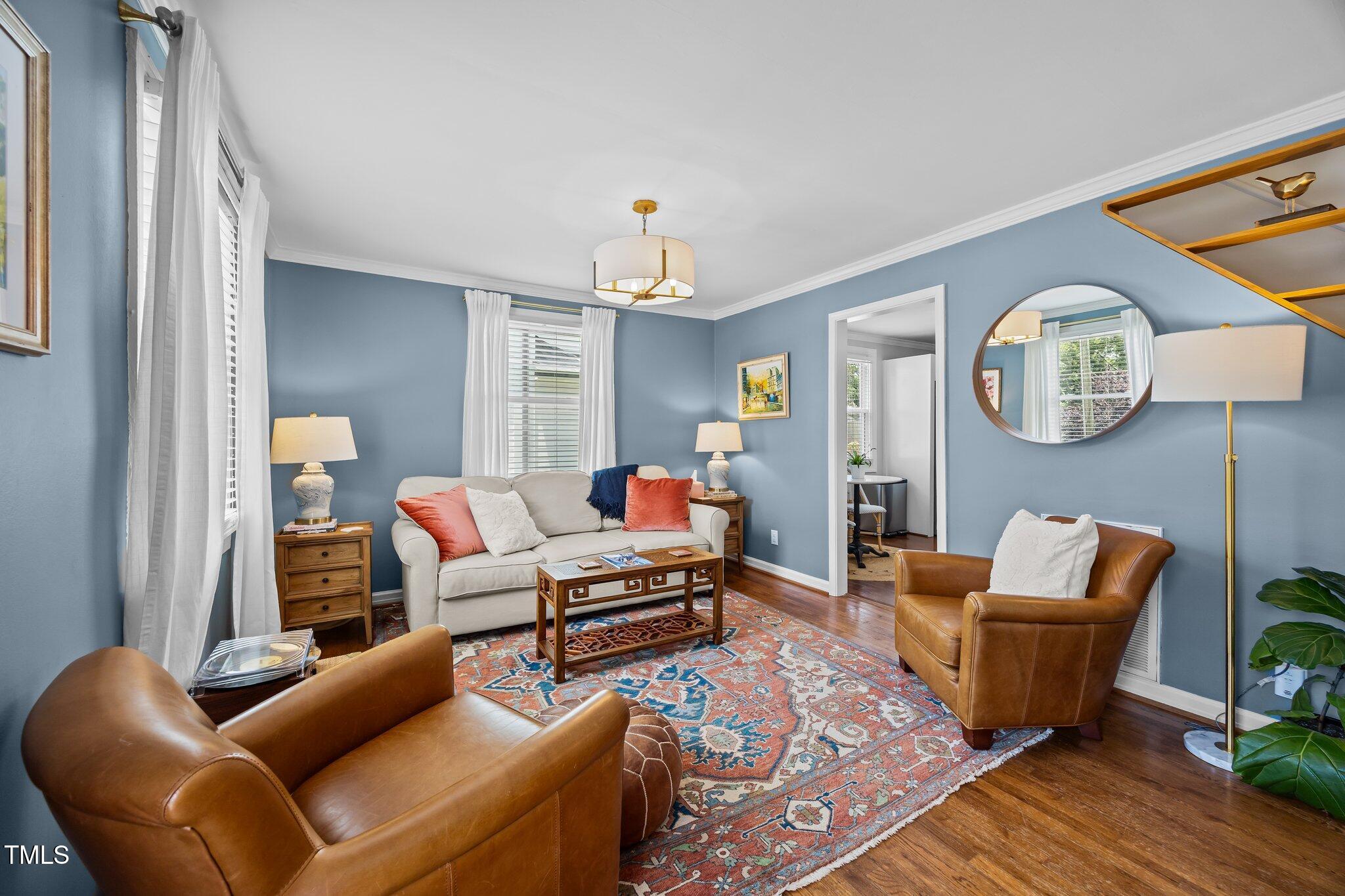 711 New Road Raleigh, NC 27608 - Photo 5 of 54 a living room with furniture and a window