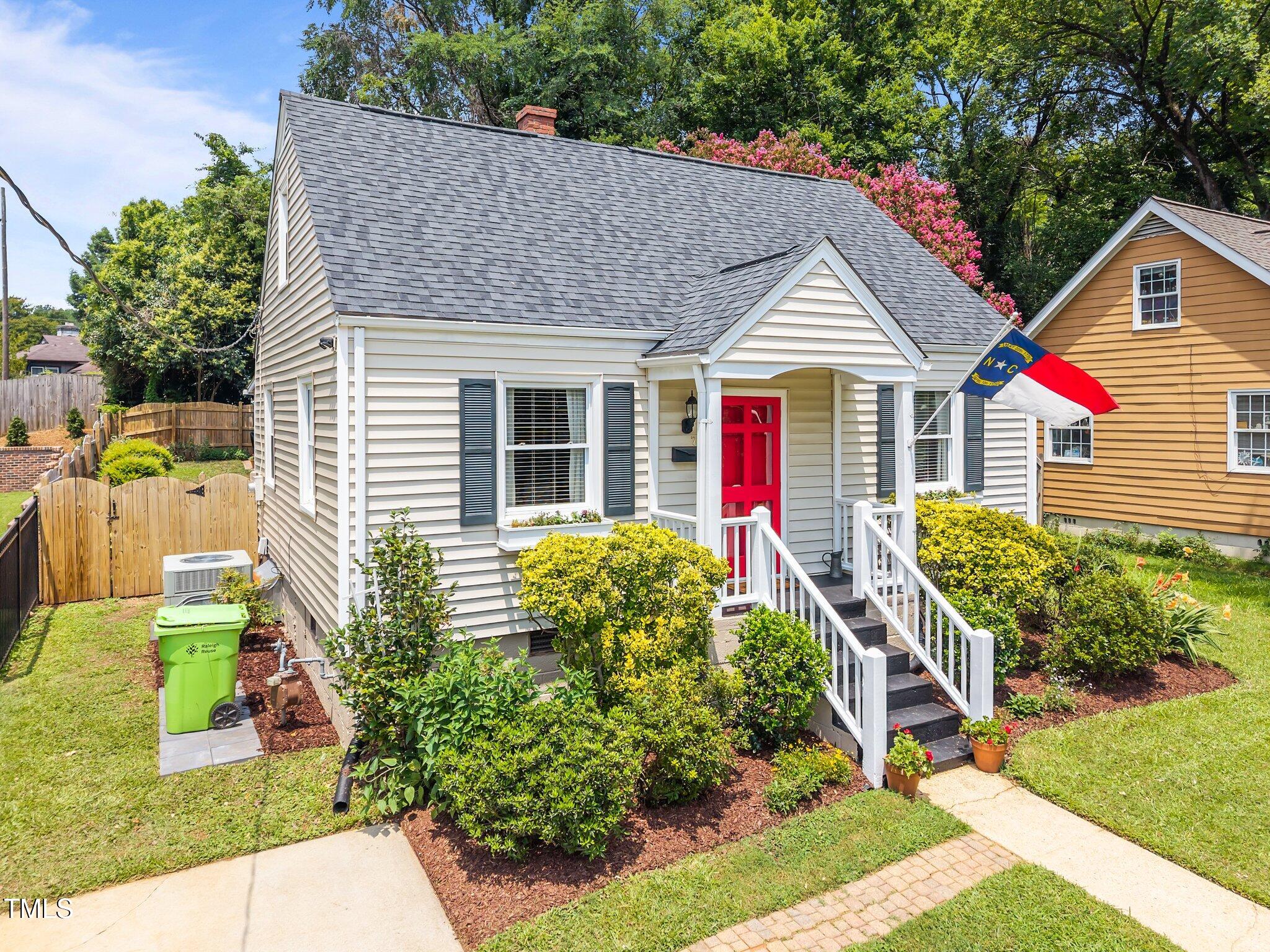 711 New Road Raleigh, NC 27608 - Photo 51 of 54 a front view of house with yard and green space