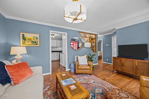 a kitchen with stainless steel appliances granite countertop a sink stove microwave and refrigerator