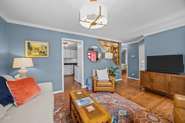 a kitchen with stainless steel appliances granite countertop a sink stove microwave and refrigerator