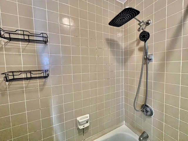 a bathroom with a sink vanity and a mirror