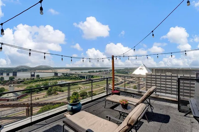 a view of a balcony with wooden floor