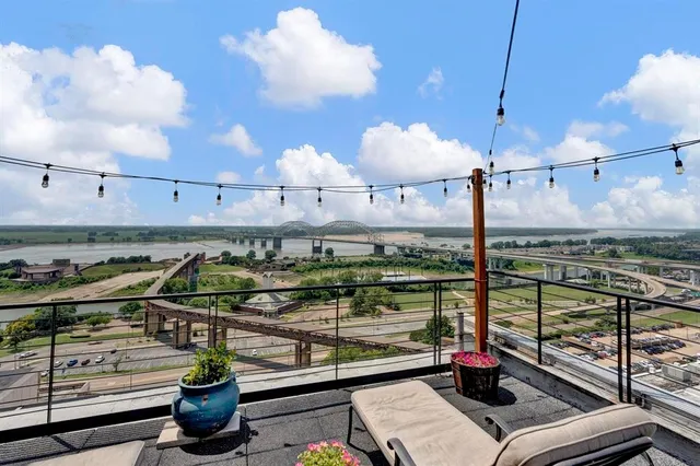 an outdoor sitting area with a table and chairs