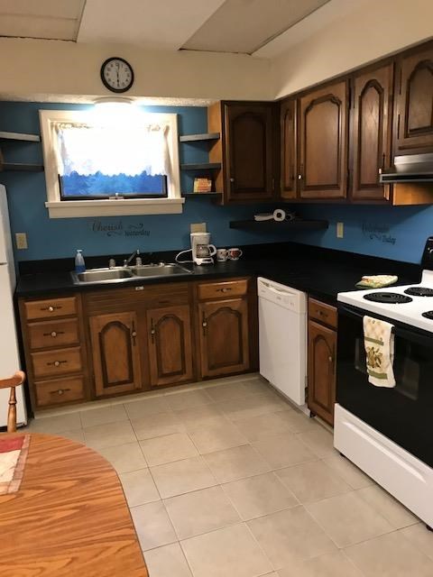 149 Madison Road Clarion, PA 16214 - Photo 14 of 39 a kitchen with stainless steel appliances granite countertop a stove a sink and a microwave