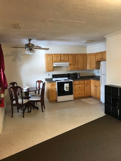 149 Madison Road Clarion, PA 16214 - Photo 6 of 39 a open kitchen with a table and chairs