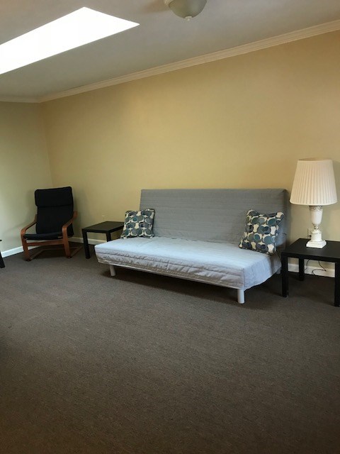 149 Madison Road Clarion, PA 16214 - Photo 8 of 39 a living room with furniture and a lamp