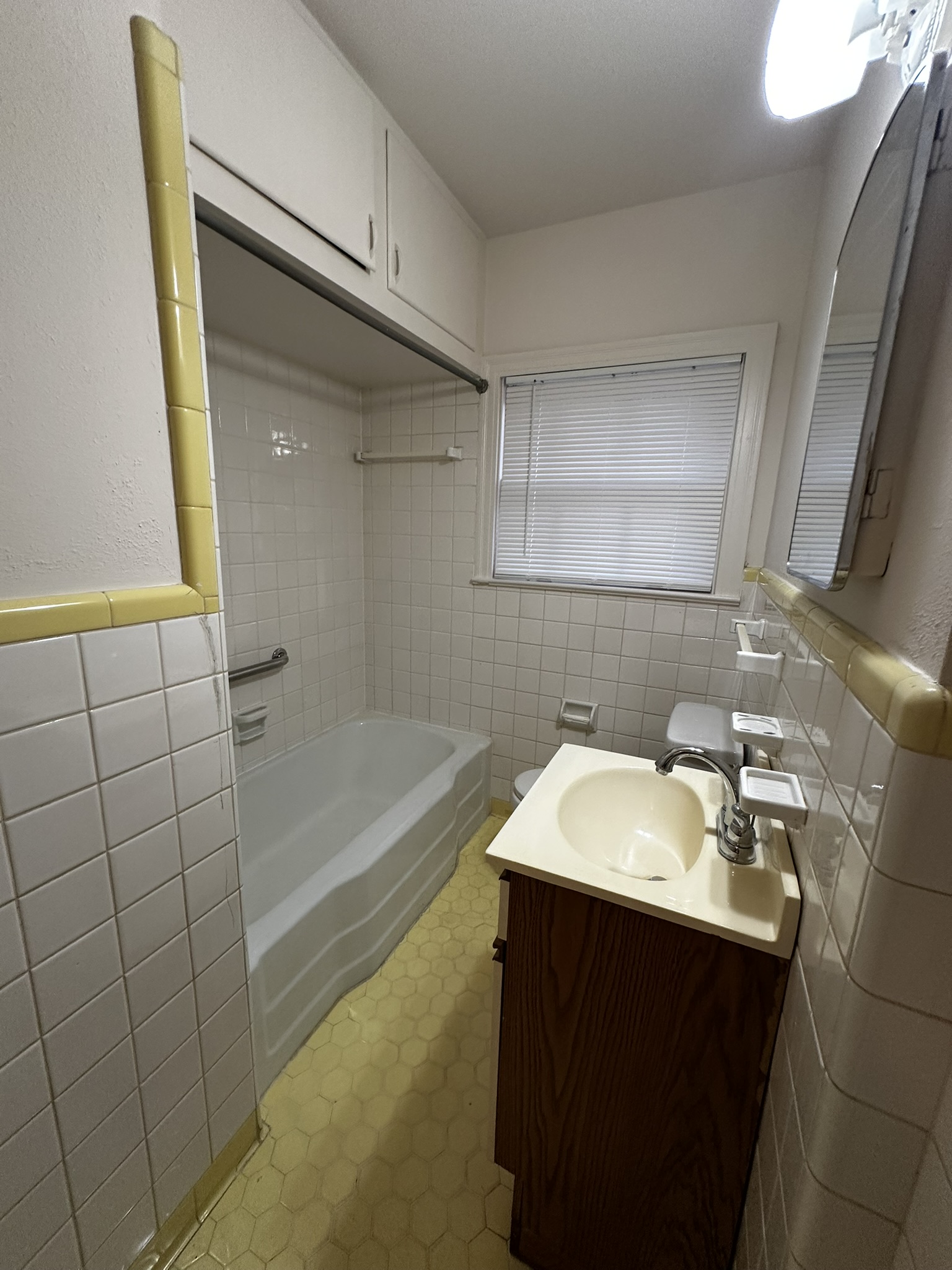 3903 Ridgelea Drive Austin, TX 78731 - Photo 13 of 17 Classic tiling and a built-in bathtub define this functional bathroom layout.