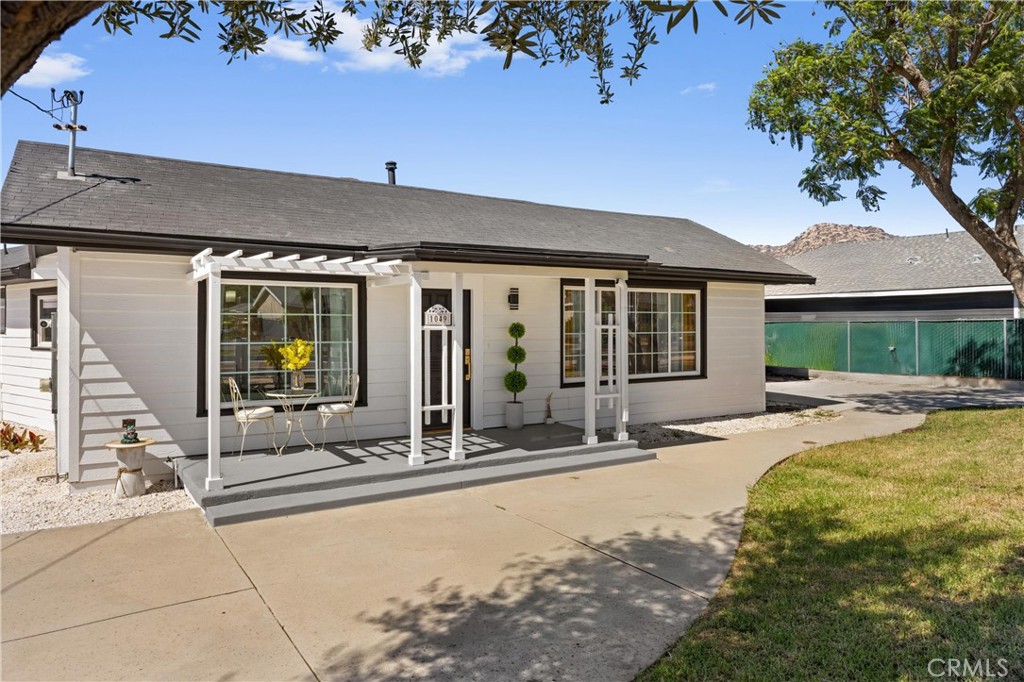 1049 Second Street Norco, CA 92860 - Photo 2 of 66 a front view of house with yard outdoor seating and barbeque oven