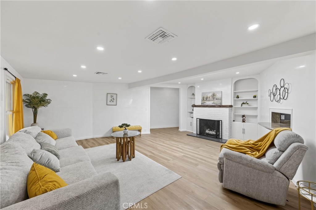 1049 Second Street Norco, CA 92860 - Photo 25 of 66 a living room with furniture and a fireplace