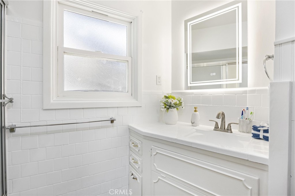 1049 Second Street Norco, CA 92860 - Photo 29 of 66 a bathroom with a sink and a mirror