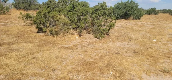 a view of snow covered with snow in the background