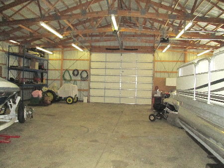 2901 East Brunswick Road Beecher, IL 60401 - Photo 3 of 8 a view of a garage with a bike and a roof