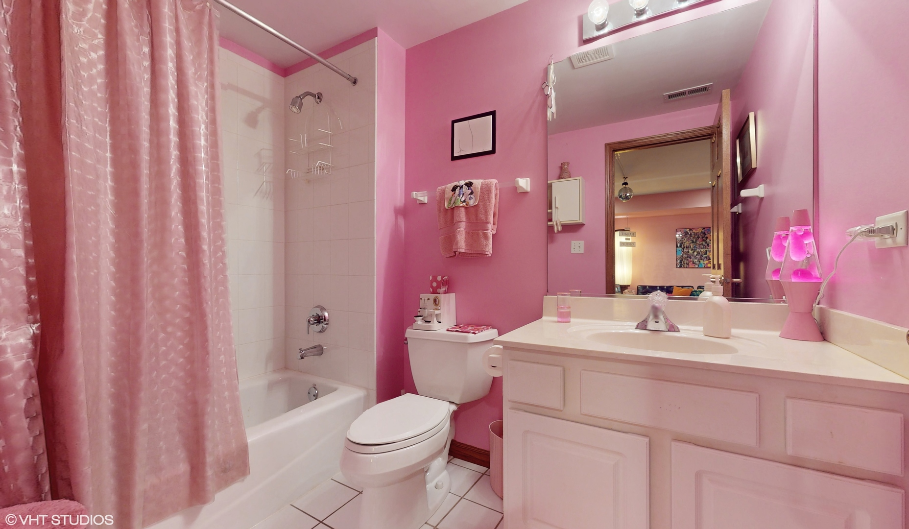 1640 Newton Avenue Park Ridge, IL 60068 - Photo 34 of 50 a bathroom with a sink a toilet a tub and shower curtain