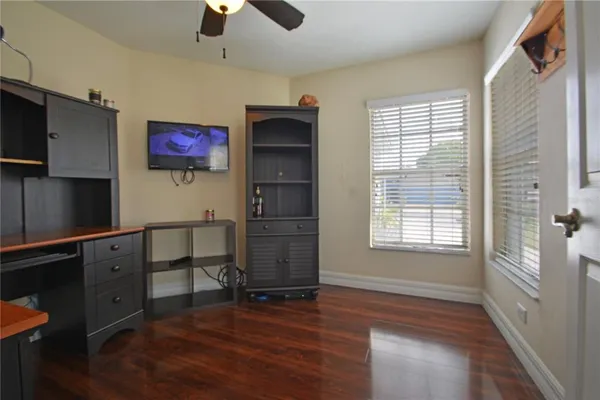 a kitchen with a refrigerator and a sink