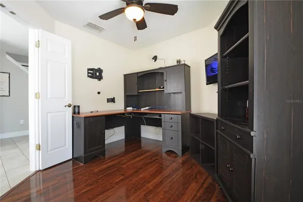 a view of workspace with window and cabinet