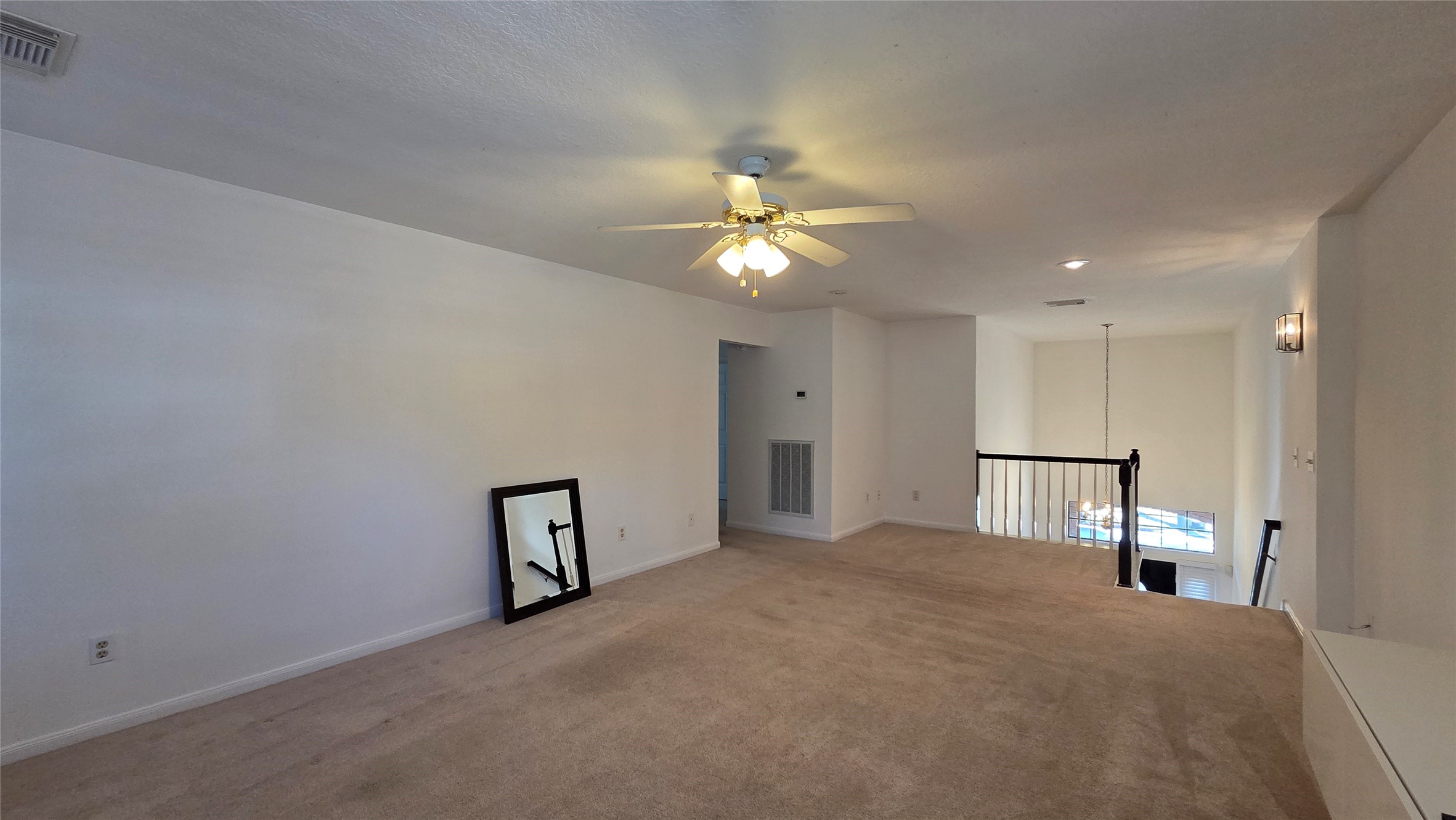 18514 Purdy Court Houston, TX 77084 - Photo 20 of 25 a view of a livingroom with a chandelier fan