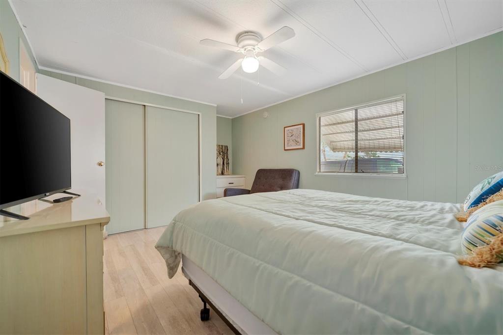 110 East St Lucia Loop Apollo Beach, FL 33572 - Photo 14 of 35 a bedroom with a bed and a flat screen tv