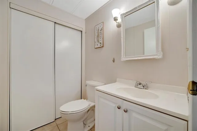 a bathroom with a sink toilet and vanity