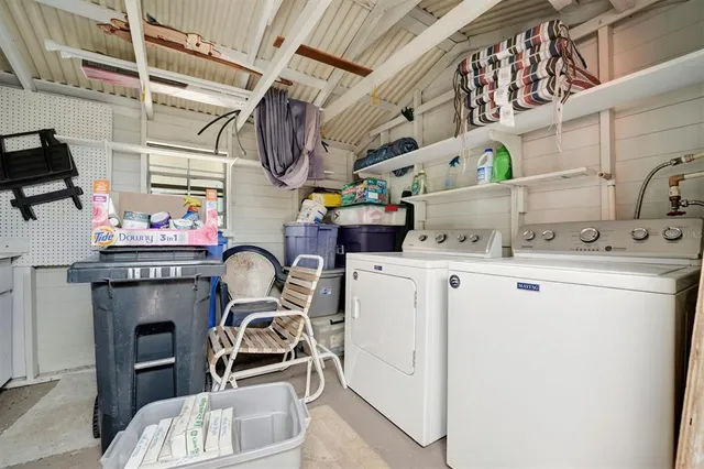 a view of a house with backyard and porch
