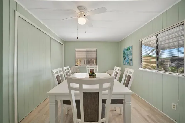 a view of a dining room with furniture window and outside view