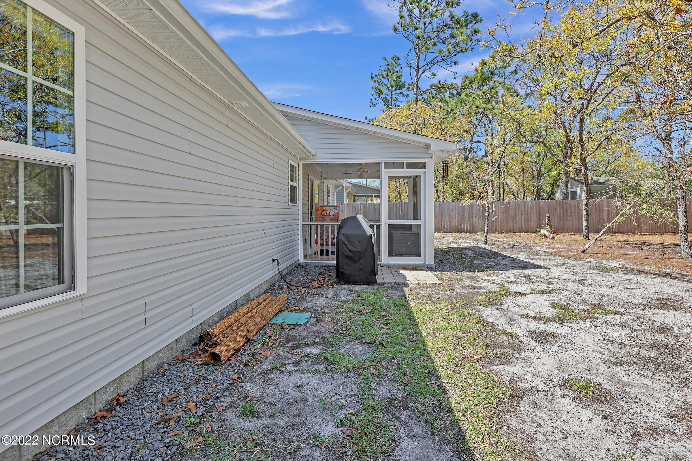 230 Ash Road Southport, NC 28461 - Photo 33 of 37 Rear yard and screened porch