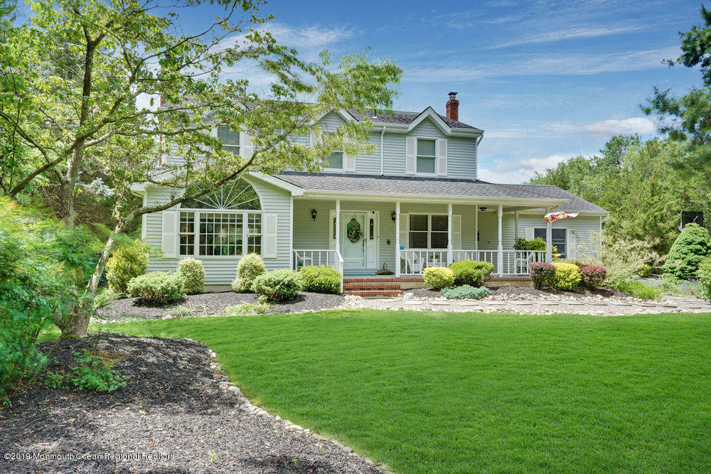 205 Forge Road West Creek, NJ 08092 - Photo 2 of 64 a front view of a house with garden and porch