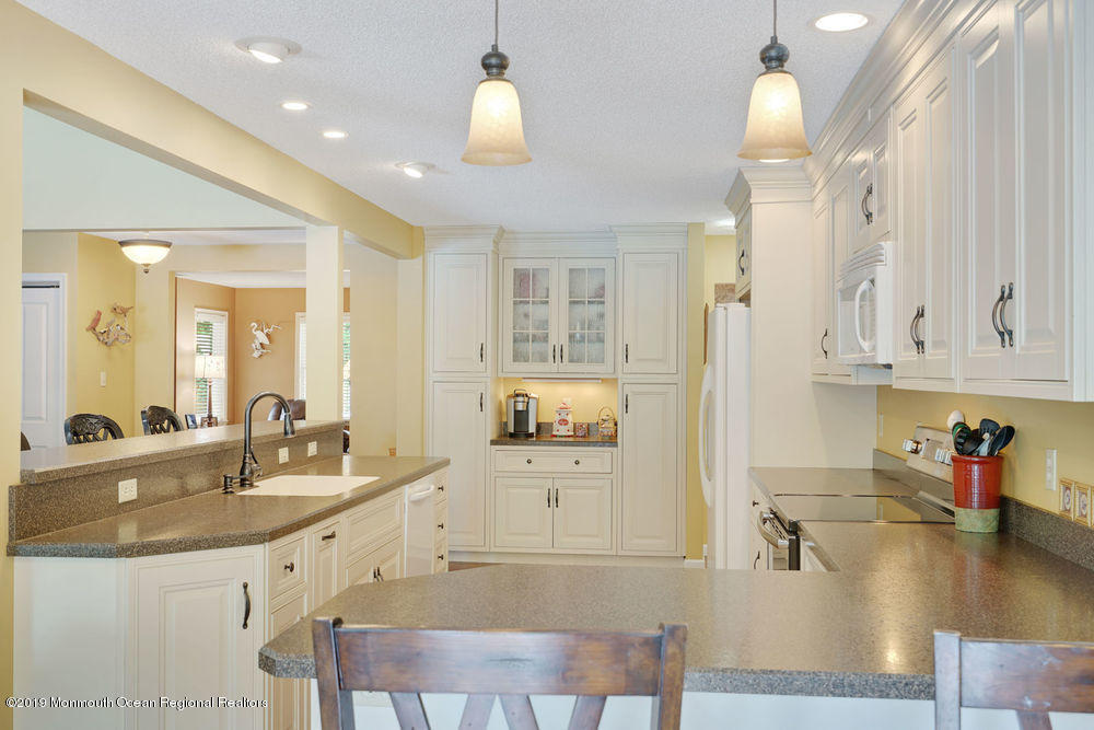 205 Forge Road West Creek, NJ 08092 - Photo 28 of 64 a kitchen with granite countertop a sink cabinets and stainless steel appliances